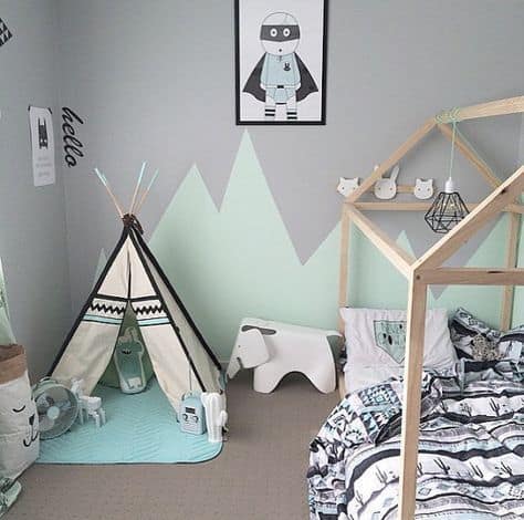 Un dormitorio en verde y gris